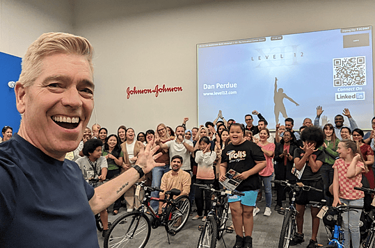 Dan Perdue leading a high-energy Ultimate Bike Build event for a corporate team in the United States.